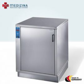 Abb. zeigt den Warmhalteschrank für Fango-Paraffin »FW 4060 N« mit einflügeliger Tür, integrierter Arbeitsplatte und 14 Einschüben für Aluminium-Fangobleche. Ausgestattet mit Temperaturregler (30-85 °C), Umluftgebläse und 1800 W Heizleistung.